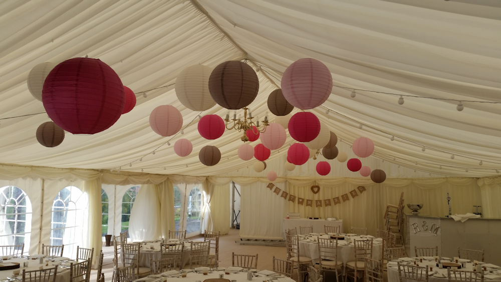 Latte and Pink Lanterns Decorate a Rustic Marquee